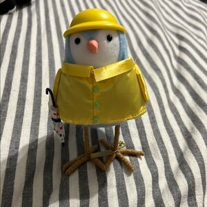 Yellow Raincoat Bird Figurine